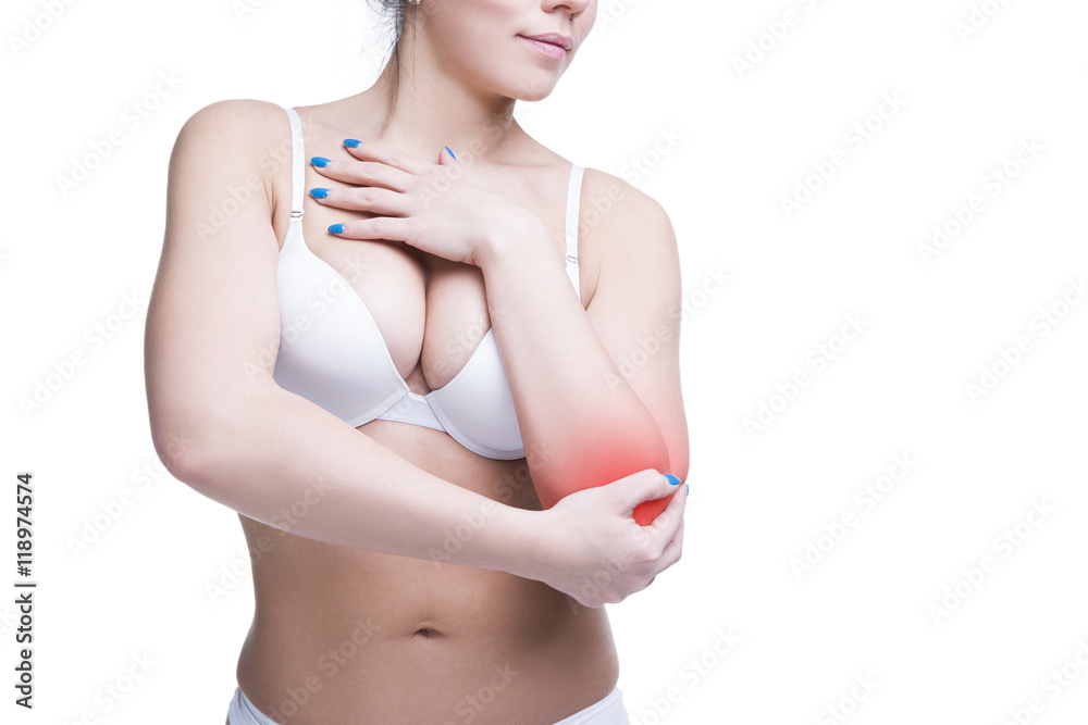 Obraz premium Young caucasian woman in bra with pain in elbow, ache in the human body, isolated on white background, copy space