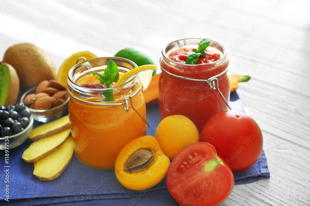 Tasty smoothie drinks with vegetables and fruits on table Tasty smoothie drinks with vegetables and fruits on table