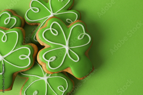 Decorative cookies on green background. Saint Patrics Day concept