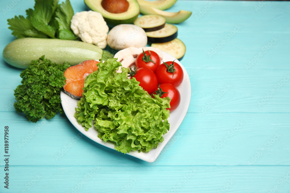 Healthy food on wooden table. Heart health concept Healthy food on wooden table. Heart health concept