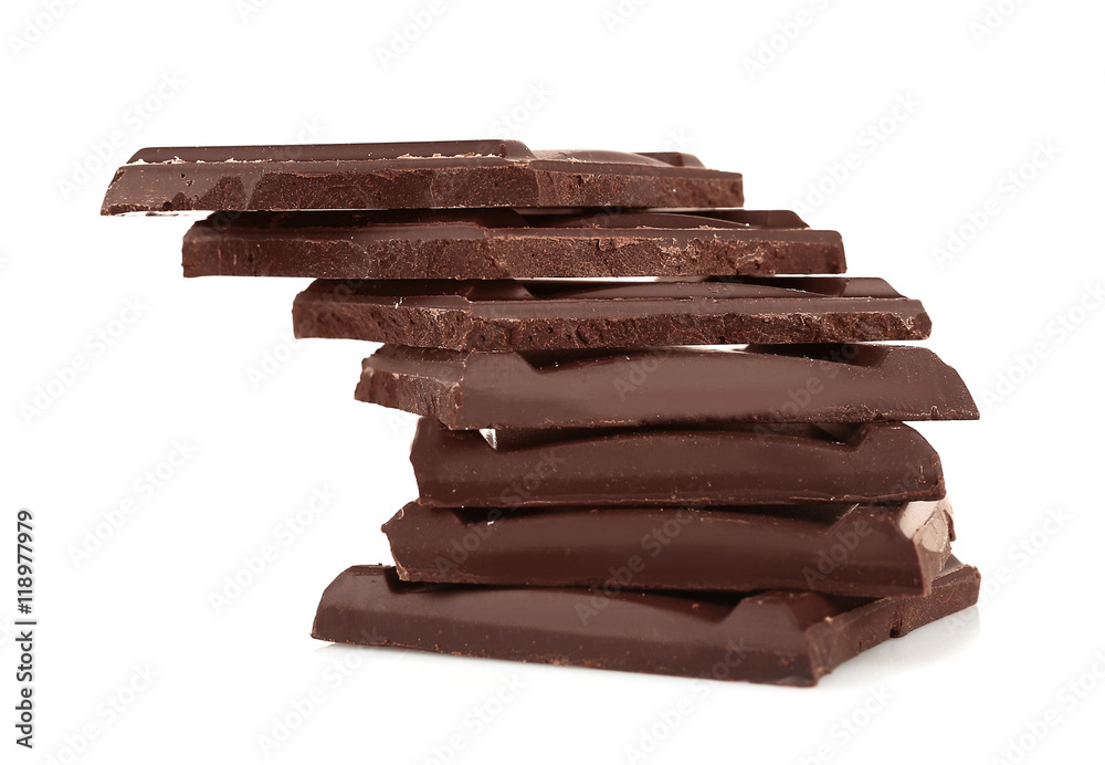 Pile of dark chocolate tiles isolated on white