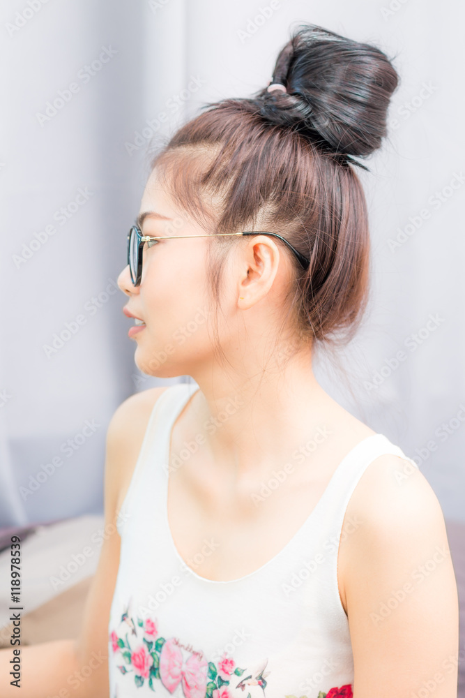 Happy casual young Asian nerd woman wearing eyeglasses Happy casual young Asian nerd woman wearing eyeglasses