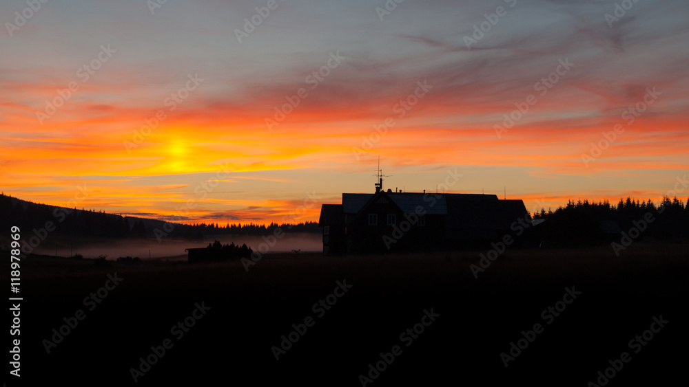 Dark silhouette of mountain hut at sunset time, Jizera Mountains, Czech Republic Dark silhouette of mountain hut at sunset time, Jizera Mountains, Czech Republic
