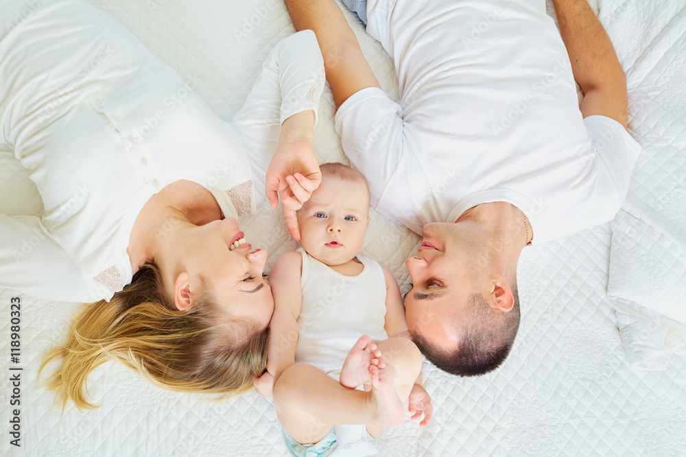The concept of a happy family. Top view of a mom, dad and baby b Stock ...