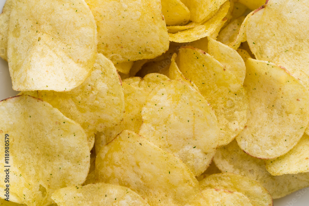 Close up potato chips on top view background.