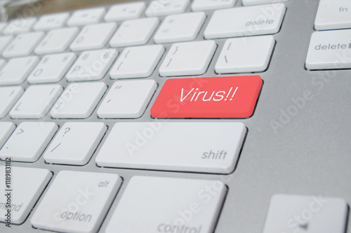 computer keyboard with word Virus