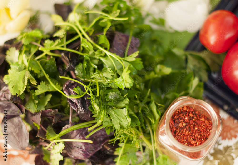 Basil, parsley, spices on table Basil, parsley, spices on table