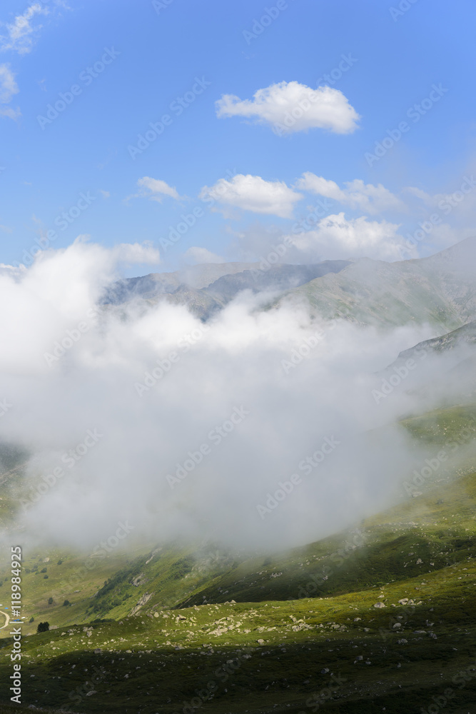 beautiful traditional plateau life and green nature on the mountains with fog