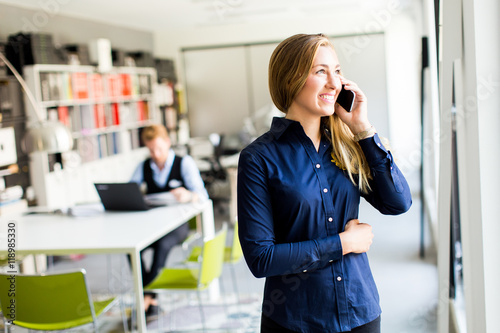Woman with telephone in the...
