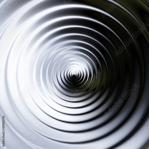 Abstract background of concentric swirling circles creating an illusion of movement. Black and white rotating background resembling molten metal