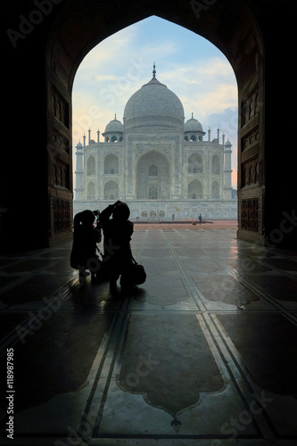 Photography Taj Mahal, people make a photo from the gate of mosque in front of Taj on sunrise, Agra, Uttar Pradesh, India