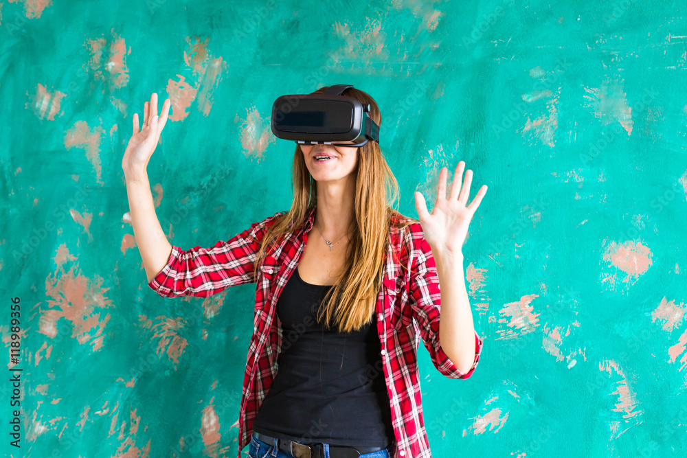 girl getting experience using VR-headset glasses of virtual reality gesticulating hands girl getting experience using VR-headset glasses of virtual reality gesticulating hands