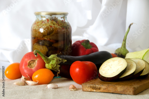 Fototapeta Naklejka Na Ścianę i Meble -  canned vegetables cutting board eggplant squash tomato