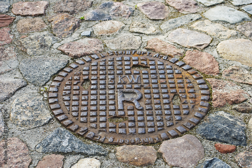 Cover of an old sewer manhole in Kaliningrad Cover of an old sewer manhole in Kaliningrad