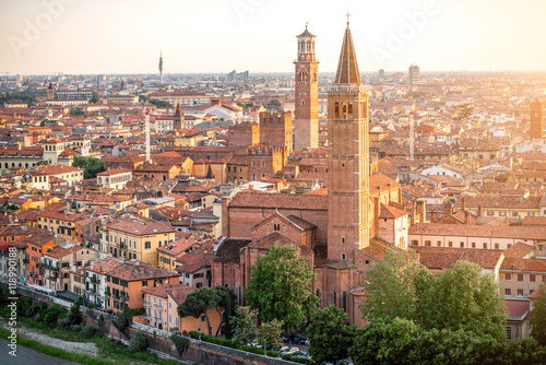 Aerial view on Verona old town with Lamberty and church towers on the sunset