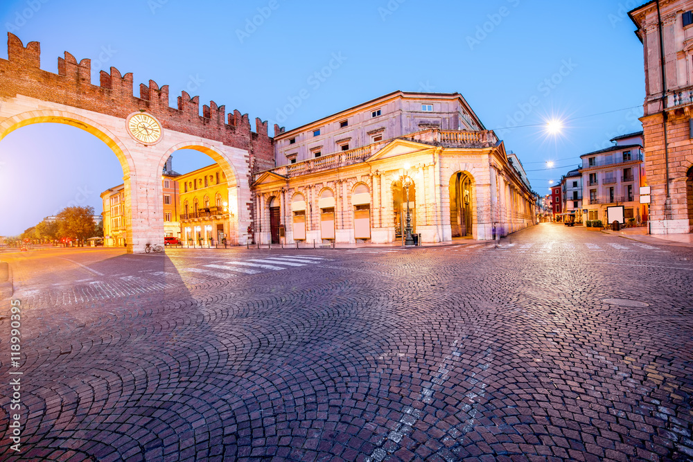 Night view on illuminated Portoni della Bra gate with museum in Verona city.