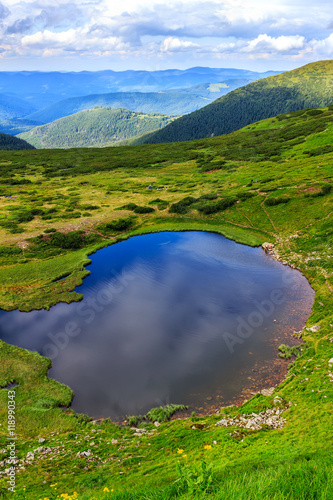 Carpathian mountains landscape, view from the height, Nesamovyte lake under hill.