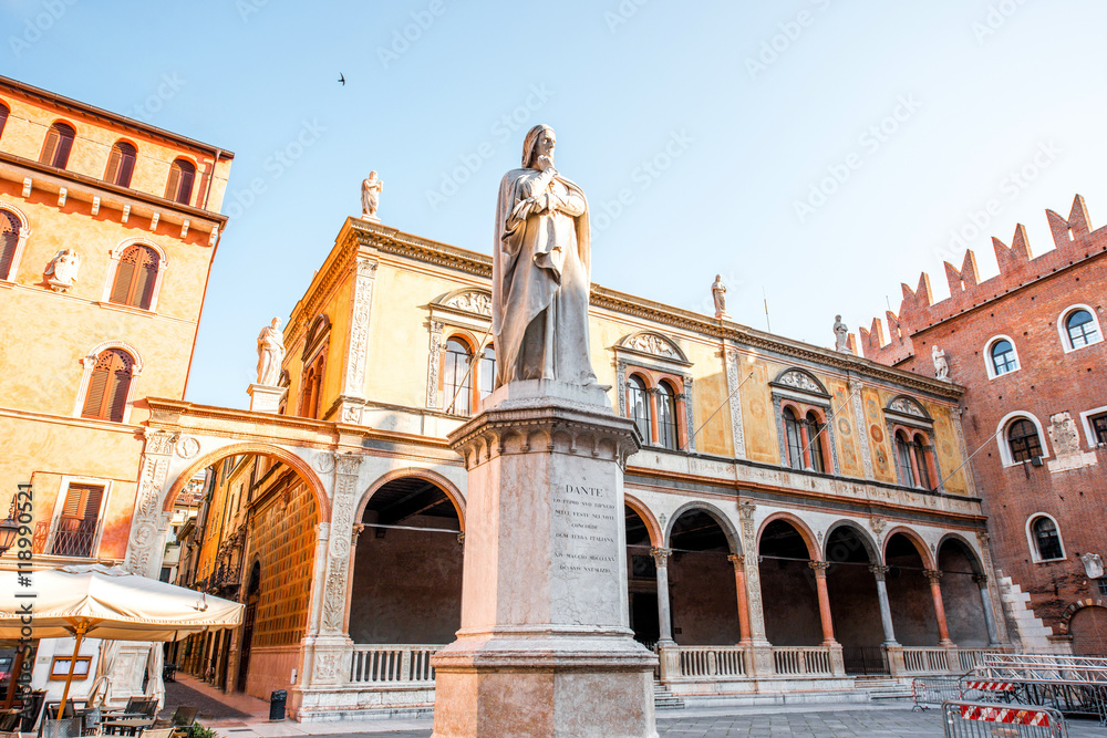 Statue of Dante Alighieri on the square near Lamberty tower in the center of Verona city in Italy
