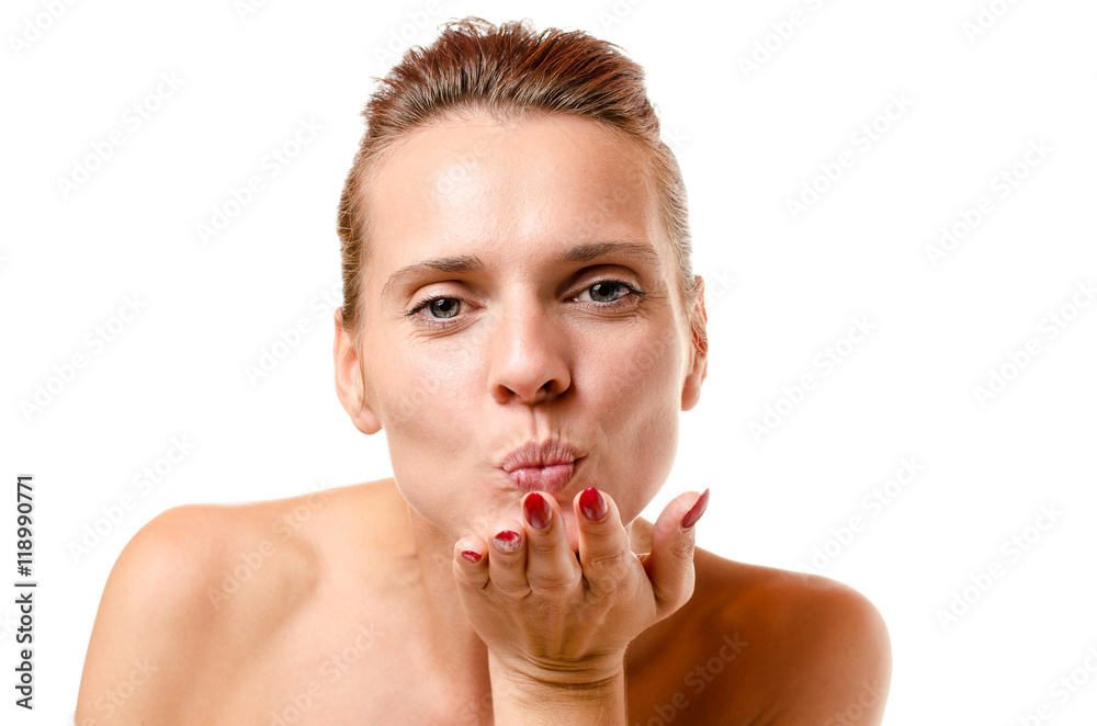 Romantic woman blowing a kiss at the camera Romantic woman blowing a kiss at the camera