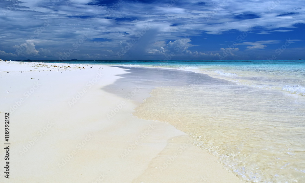 White sandy beach on a sunny day.