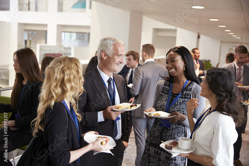 Delegates Networking During Conference Lunch Break photo