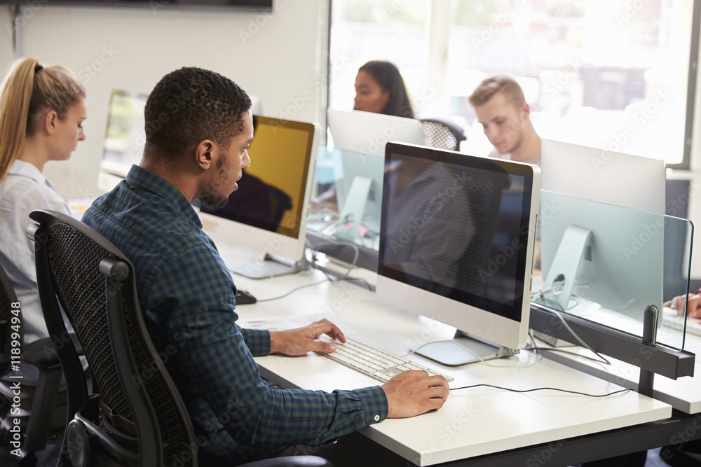 Group Of University Students Using Online Resources