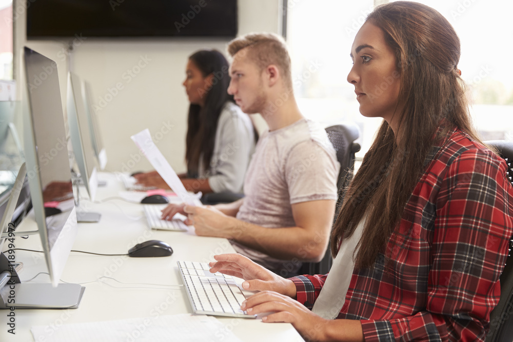 Group Of University Students Using Online Resources