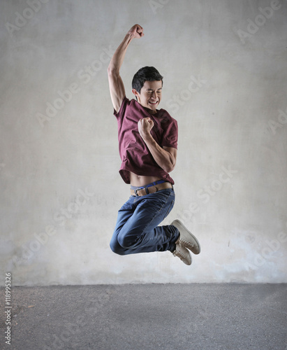 Jubilant guy jumping