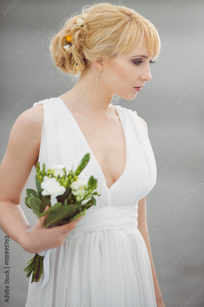 Young beautiful bride with a wedding bouquet. Young beautiful bride with a wedding bouquet.