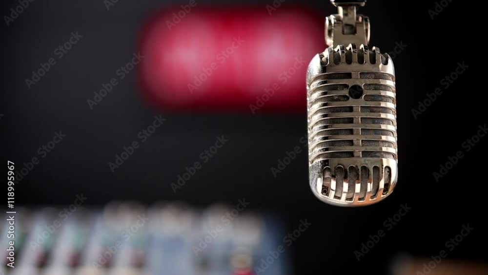 00:00 | 00:00
1×
In sound studio production. Camera shift focus from retro microphone to an on air signboard and lighting is turn on.