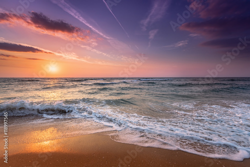 Brilliant ocean beach sunrise. © vrstudio