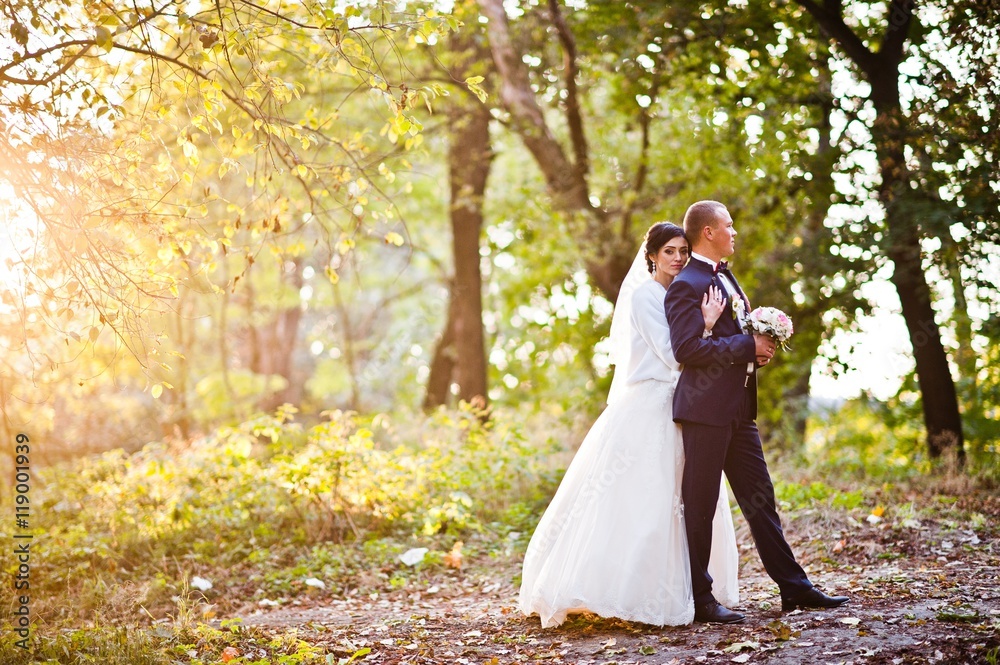 Young stylish wedding couple at sunset Young stylish wedding couple at sunset