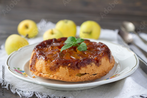 Homemade apple pie with caramel and fresh apples, rustic style, selective focus