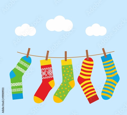 colorful bright socks on a rope with clothespins against a background of sky and clouds. Cute clothes. Cartoon summer illustration.