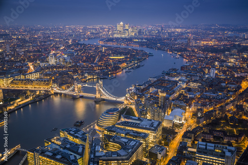 London  England - Aerial Skyline view of London with the iconic Tower Bridge  Tower of London and skyscrapers of Canary Wharf at dusk