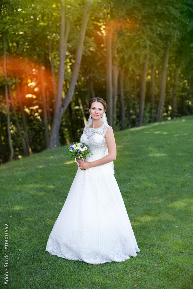 Fototapeta premium Bride with a wreath on his head, outside the city