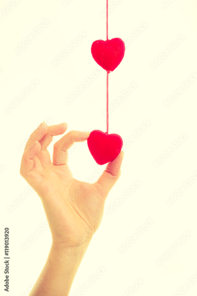 Fototapeta premium Female hand with little hearts.