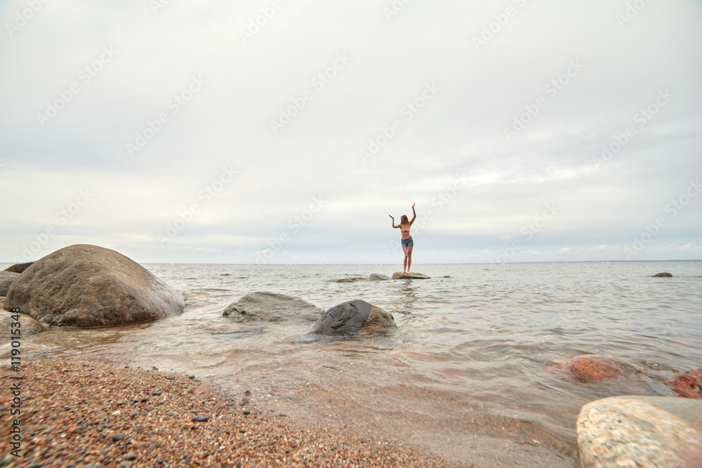 woman standing on stone