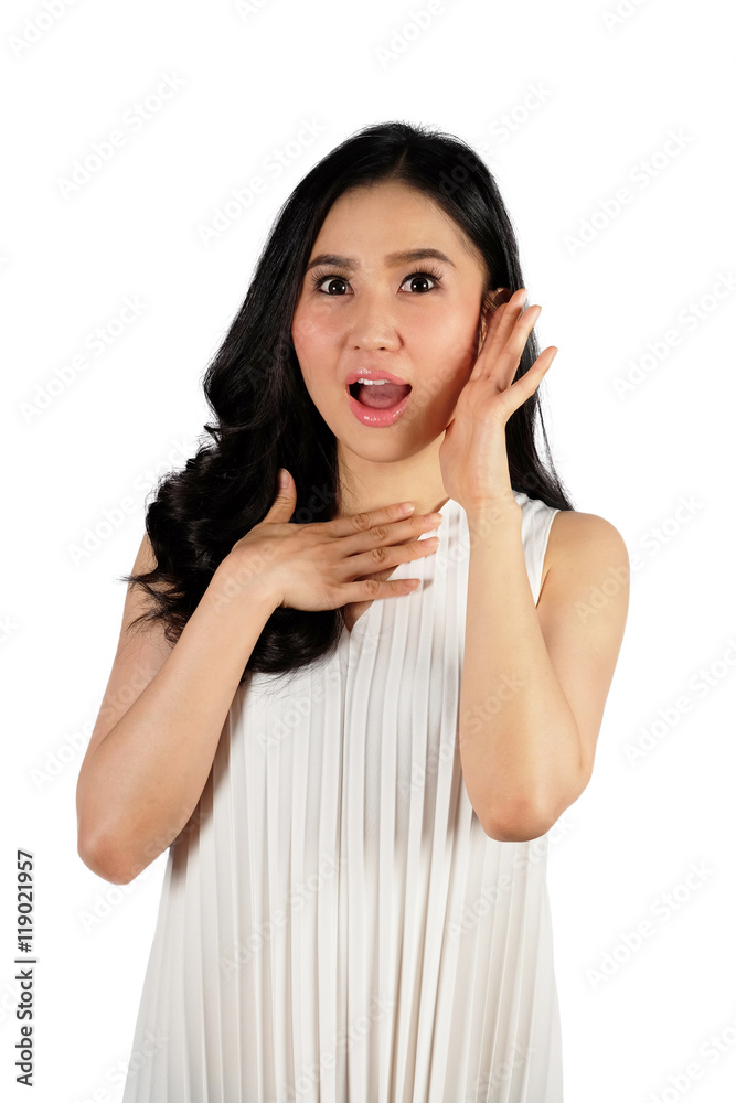 Young woman with surprised face wearing white dress looking at camera on white background Young woman with surprised face wearing white dress looking at camera on white background