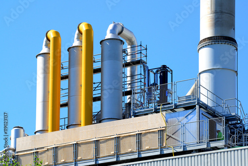 Industrial smoke filters. Scrubbers next to smokestack. 