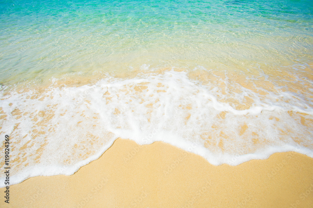 Wave of the sea on the sand beach StockFoto Adobe Stock