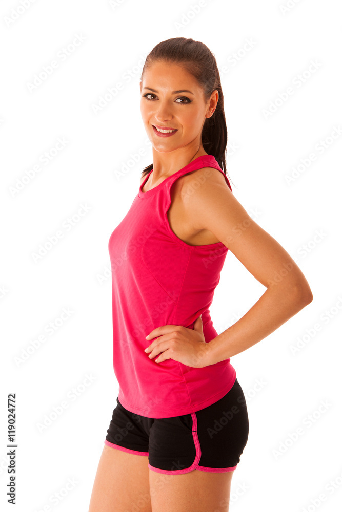 Fit woman in workout dress standing over white background