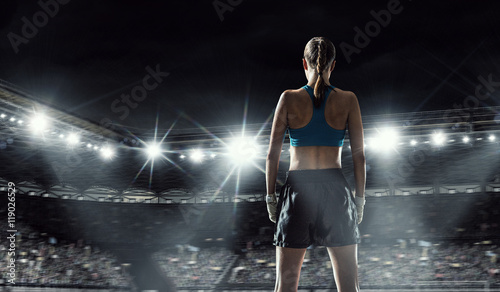 Young boxer woman at ring . Mixed media © Sergey Nivens