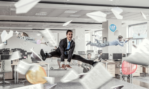 Wallpaper Mural Jumping businessman in office . Mixed media Torontodigital.ca
