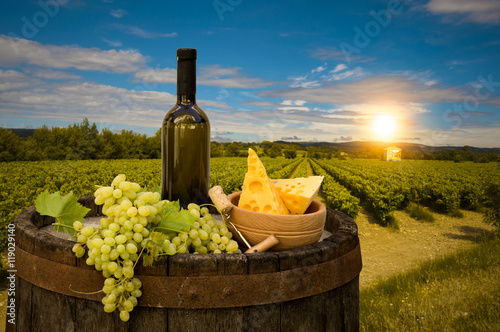 Fototapeta Naklejka Na Ścianę i Meble -  Wine and vineyard in Tuscany sunset. Italy