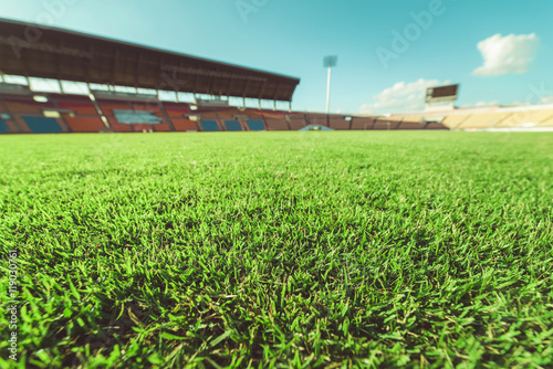 Green grass in soccer stadium , vintage
