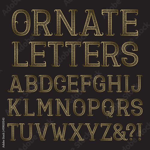Golden ornate capital letters with tendrils. Decorative patterned vintage font. Isolated latin alphabet.