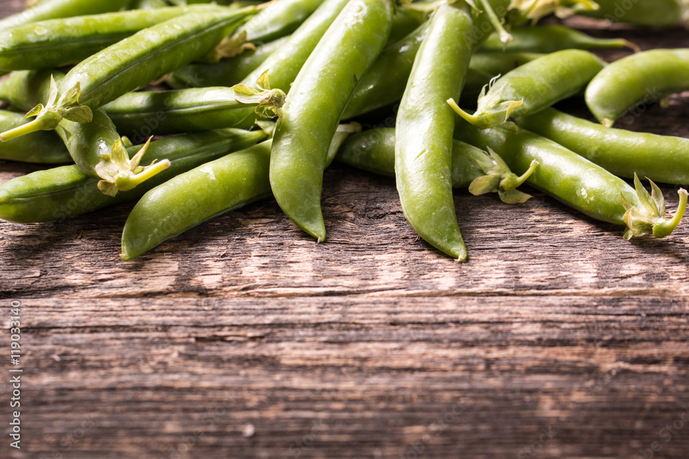 green peas on wooden table ,healthy concept green peas on wooden table ,healthy concept