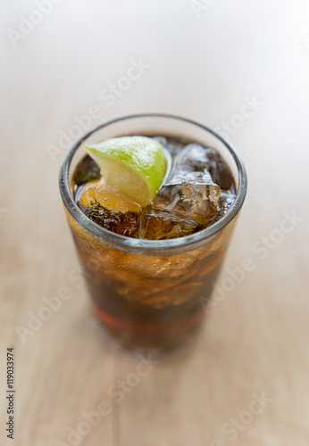 Cuba Libre drink on wooden table