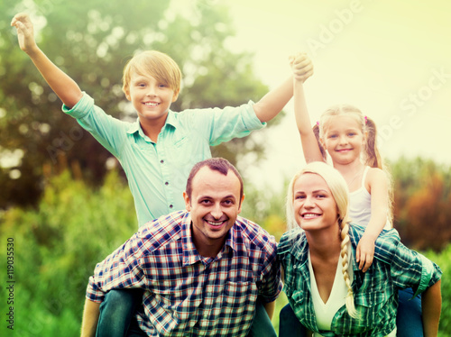 Portrait of family with kids enjoying